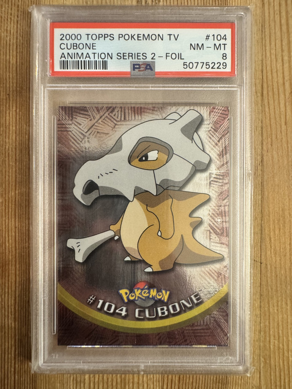 Cubone - 104 Topps Holo Foil Series 2 Blue Label PSA 8